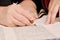 Closeup detail of a Rabbi writing a Torah manuscript scroll