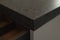 Closeup detail shot of gray terrazzo kitchen countertop with black marble