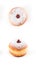 Closeup detail of tasty donut with powder and jam, isolated on white background