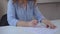 Closeup detail woman hands sign contract