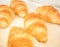 Closeup details of fresh baked Croissants in bakery basket