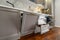 Closeup details of grey and white modern classic kitchen, all doors are open