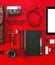 Closeup of different photography objects on red background.