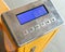 Closeup digital screen of check weight scales on hand pallet truck