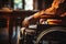 Closeup of disabled mans hand on wheelchair wheel, displaying strength