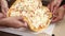 Closeup of diverse people hands taking pizza slices from box