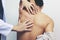 Closeup of Doctor examines or treatment the man with shoulder pain or neck pain on white background,Health concept