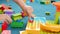 Closeup dolly 4k video of little child building track for marble run with colorful bricks and blocks. Concept of