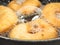 Closeup of donuts cooking in boiling oil