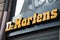 Closeup of Dr. Martens logo on store front in the street
