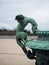 Closeup of dragon figure statue bronze vase fountain decoration in Parterre du Midi Versailles castle gardens France