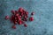 Closeup on dried lingonberries on stone substrate