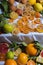 Closeup of dried orange slices and other citruses isolated on the white fabric