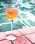 Closeup of a drink near swimming pool