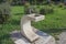 Closeup of drinking water fountain in public park, composed of stainless faucets and marble. A tap with drinking water outdoors