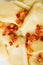Closeup dumplings sprinkled with pork scratchings food background