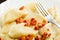 Closeup dumplings sprinkled with pork scratchings food background