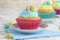 Closeup easter cupcake with mini colorful eggs