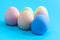 Closeup of Easter eggs painted in plain colors.