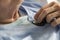 Closeup of elderly woman checking heart beats with stethoscope