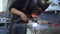 Closeup employee in a mask doing the welding in a workshop