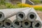 Closeup of ends of utility poles laying on ground