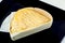 A closeup of Epoisses cheese a soft french cheese.