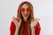 Closeup excited screaming young woman. shock, Shocked girl in red hoodie. Wow, surprised female. Fashion sweatshirt isolated on