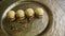 Closeup exclusive dessert decorated four spherical sponge biscuits spinning on plate
