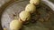 Closeup executive decorated four spherical sponge biscuits spinning on plate