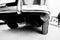 Closeup exhaust pipe of old vintage car. Black and white photo