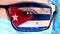 Closeup, eye, part of doctor face in medical mask, glasses, which painted in colors of Cuba flag. Many viruses, germs