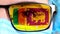 Closeup, eye, part of doctor face in medical mask, glasses, which painted in colors of Sri Lanka flag. Many viruses