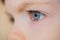 Closeup of eyes of a blue-eyed child with long eyelashes