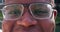 Closeup, eyes and man with glasses, face and optometry with clear vision, retina and frames. Portrait, zoom or person