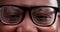 Closeup, eyes and man with glasses, vision and optometry with healthy sight, looking or lens prescription. Person, zoom