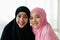 Closeup face. Asian Muslim women wear black and pink hijab. take portrait photo Indicates a happy smile in a white background