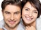 Closeup face of beautiful happy couple - isolated