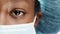 Closeup of face, black woman and doctor with eye, mask for surgery or healthcare and surgical cap. Medicine, health and