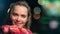 Closeup face of joyful festive girl with heap of fragrance rose flower. Shot with RED camera in 4K