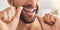 Closeup, face and man flossing teeth at home for healthy dental wellness, plaque and gingivitis. Happy guy, oral thread