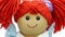 Closeup face rag doll smiling on a white background focus transition animation