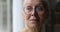 Closeup face of sad upset elderly female pensioner in eyewear