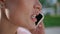 Closeup face woman calling smartphone on street. Businesswoman talking phone