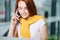 Closeup facial portrait of happy redhead woman on mobile phone call