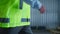 Closeup factory worker walking at warehouse supply complex checking production