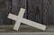 Closeup fallen wooden cross with rustic wooden background