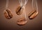 Closeup falling coffee beans with smoke on brown background