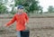 Closeup farmer hand holding rice seeds for sowing in the field