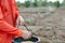 Closeup farmer hand holding rice seeds for sowing in the field